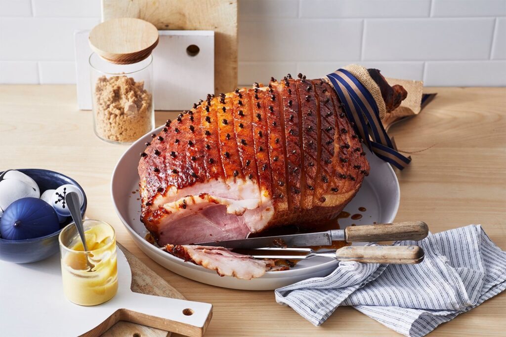 a twist on traditional christmas ham glazed with maple and bourbon