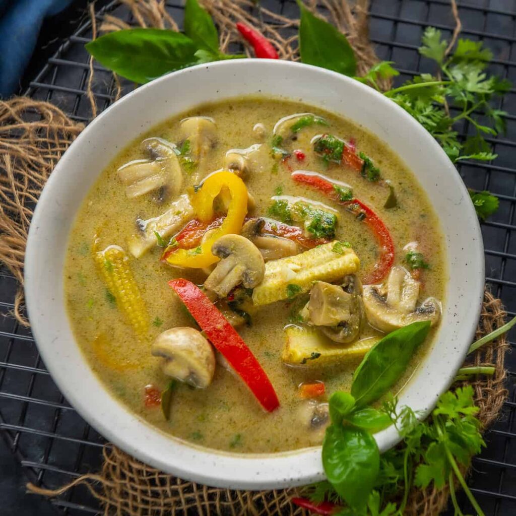 tasting the spicy and aromatic flavors of thai green curry