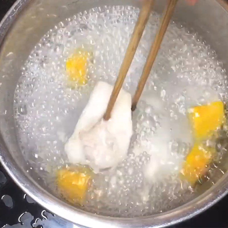 Step 2 Boil the fish and pumpkin for Snakehead fish porridge with pumpkin and spinach