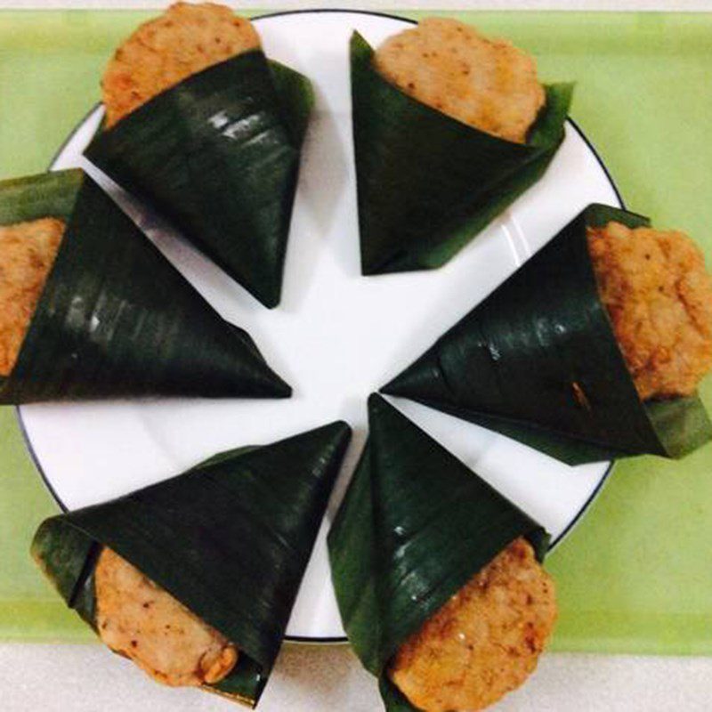 Step 3 Frying fish cake Wrapped fish cake in banana leaf