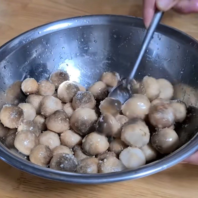 Step 2 Marinate the mushrooms Straw mushrooms cooked with pepper