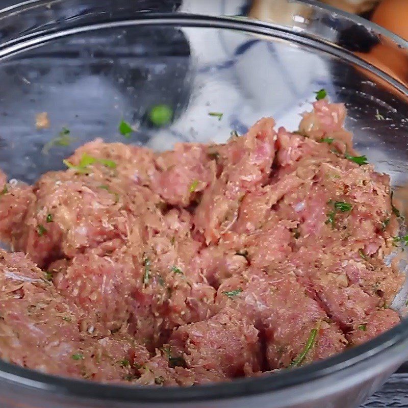 Step 2 Marinating the meat Pork meatballs wrapped with straw mushrooms