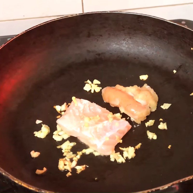 Step 3 Sauté and shred the fish for Catfish Porridge with Red Pumpkin and Cheese