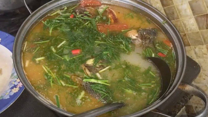 Snapper cooked with sour soup and fermented rice