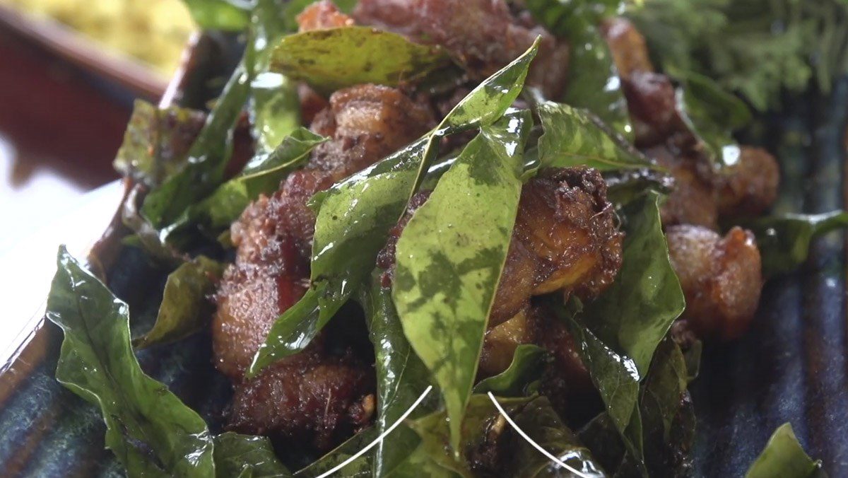 Fried pork belly with wild betel leaves