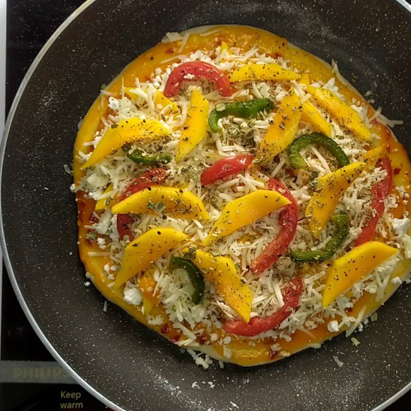 Step 4 Rolling the dough and covering the pizza filling Mango pizza