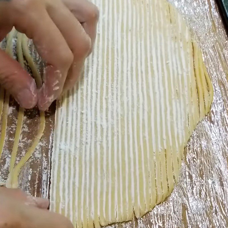 Step 2 Roll out the dough and cut into thin strands Fresh egg noodles