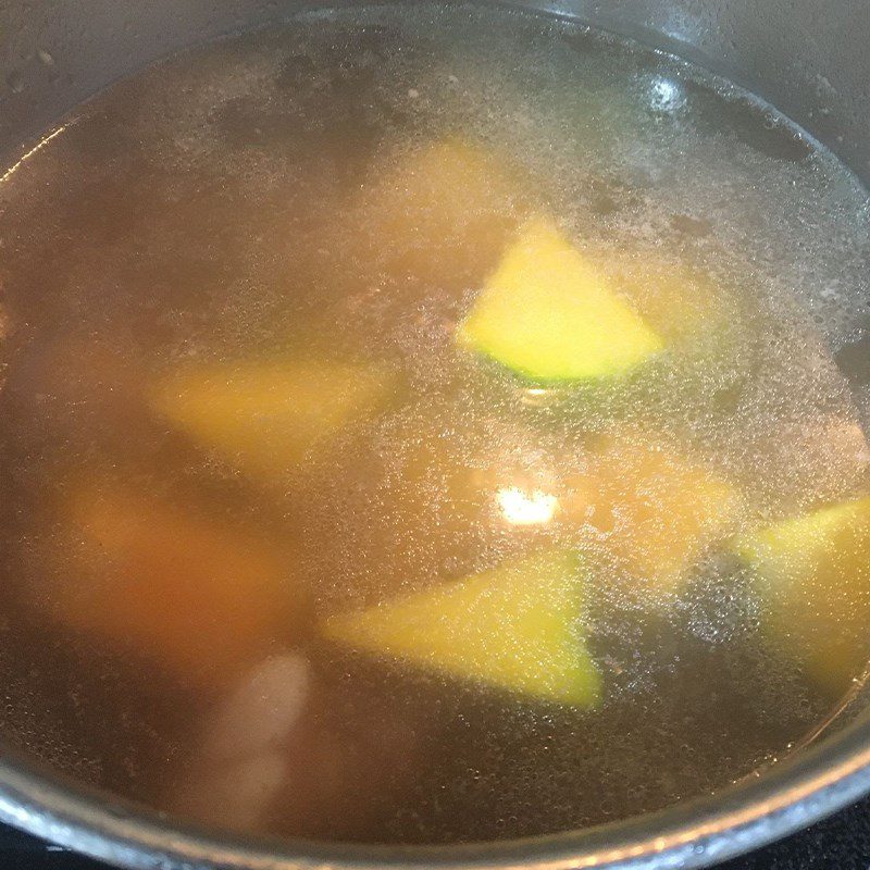 Step 3 Cooking pumpkin soup with pork ribs Pumpkin soup cooked with pork ribs