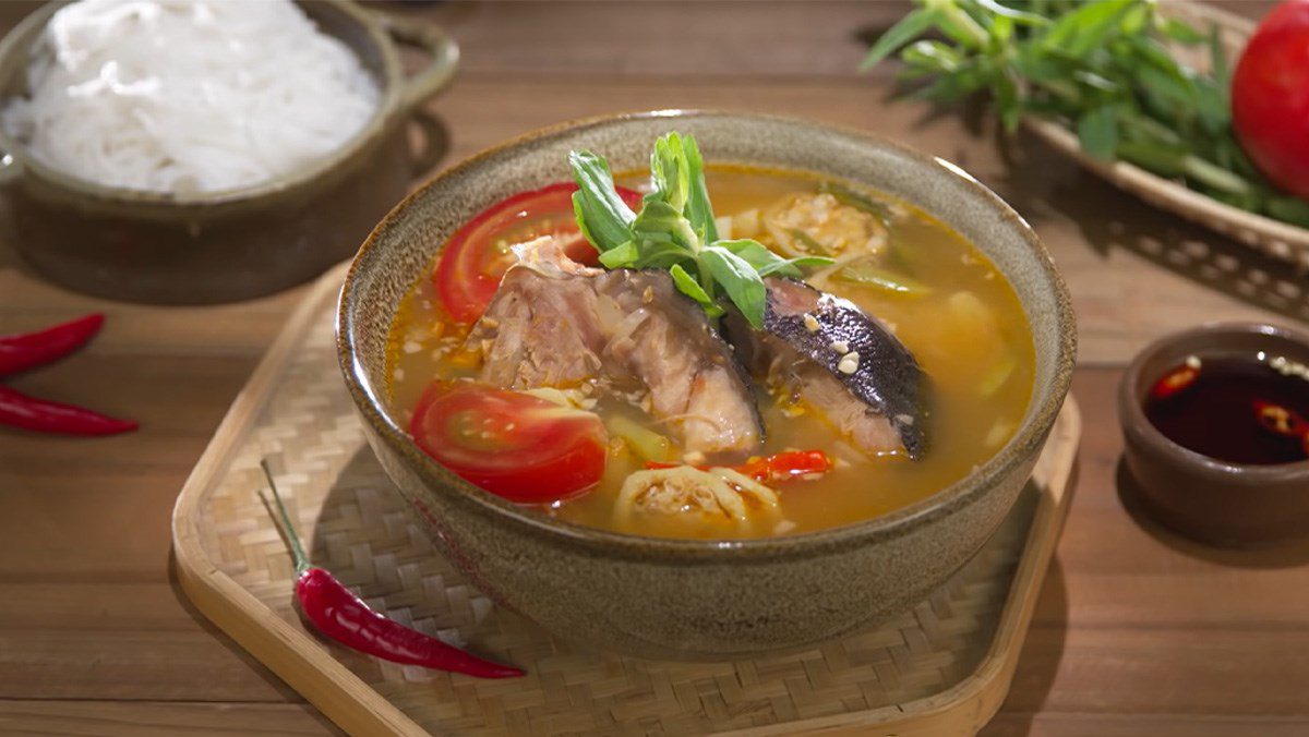 Sour fish head soup with green banana