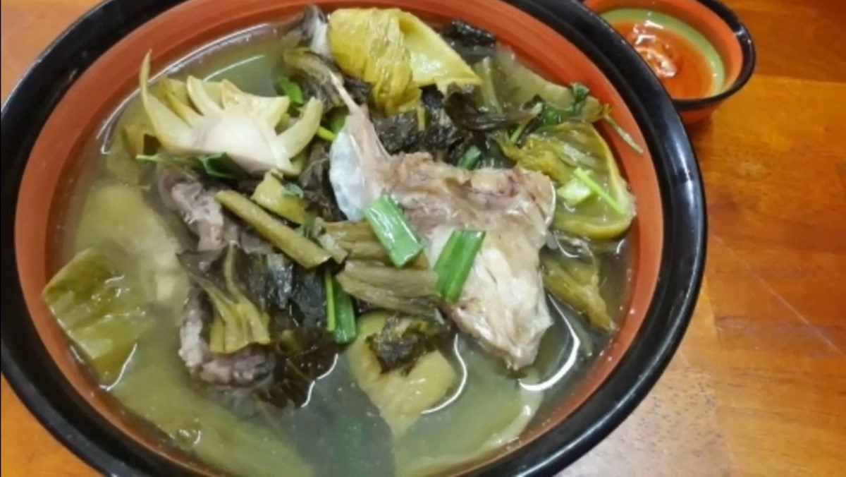 Sour soup with grouper fish head and pickled mustard greens