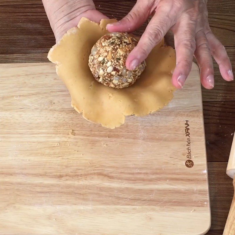 Step 4 Divide the dough and wrap the filling Mooncake made with a rice cooker