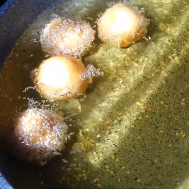 Step 5 Fry the cake Orange cake with sesame sugar coating