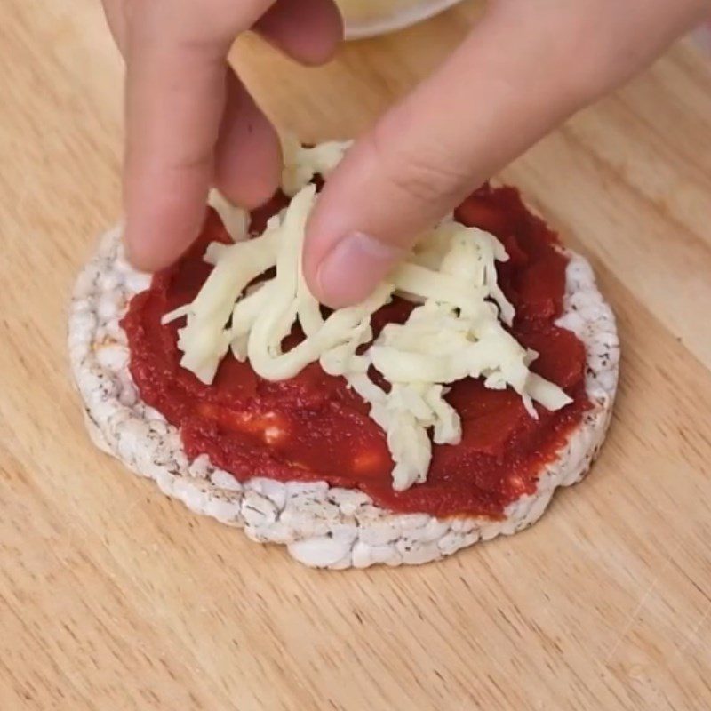 Step 2 Add the filling on the brown rice cake Mini brown rice pizza