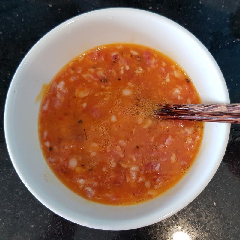 Step 2 Beat the egg mixture for Fried egg with minced pork and betel leaves