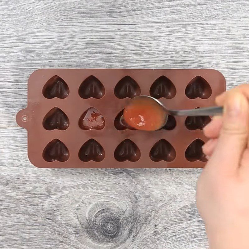 Step 4 Pouring gummy candy into molds Gummy candy in heart shape