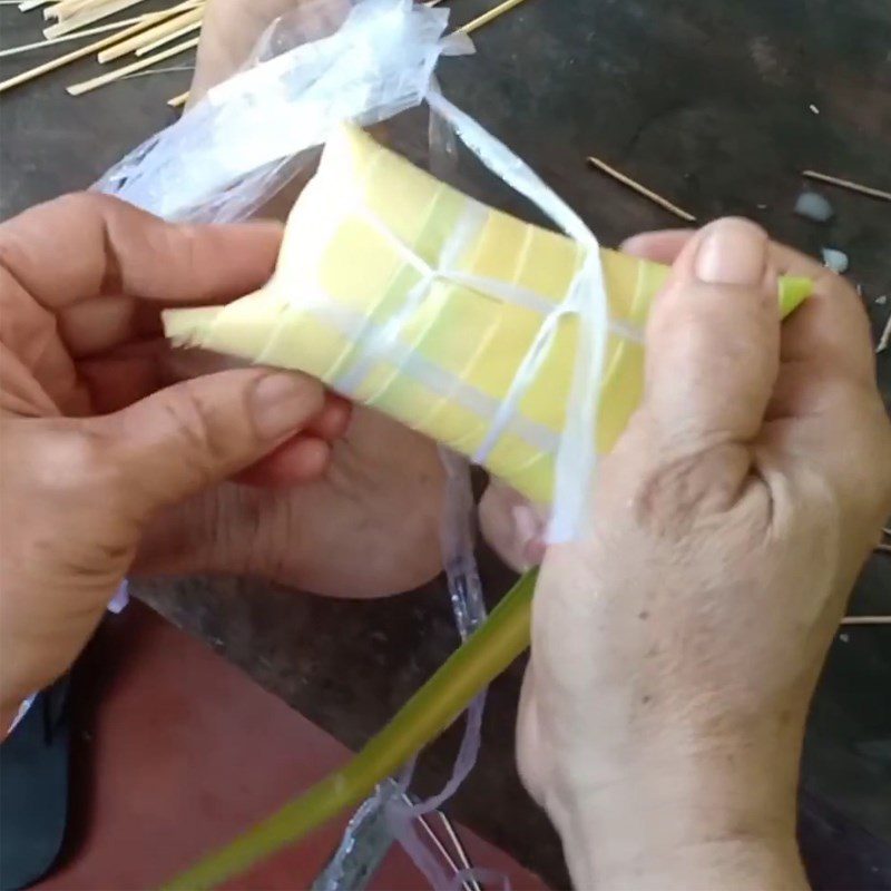 Step 4 Stuff the filling and wrap the cake Coconut leaf cake Ben Tre