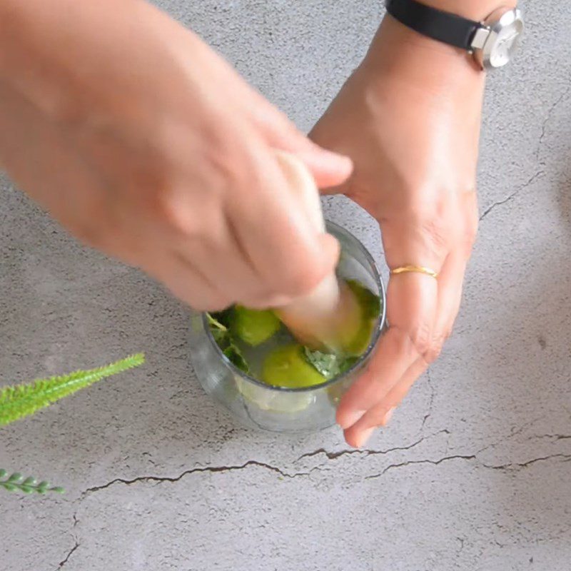 Step 2 Pound the lime and mint leaves for Fresh Mango Mojito