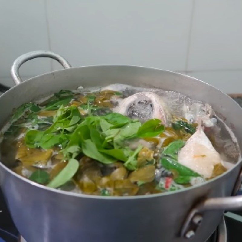 Step 5 Completion Sour fish cooked with giang leaves