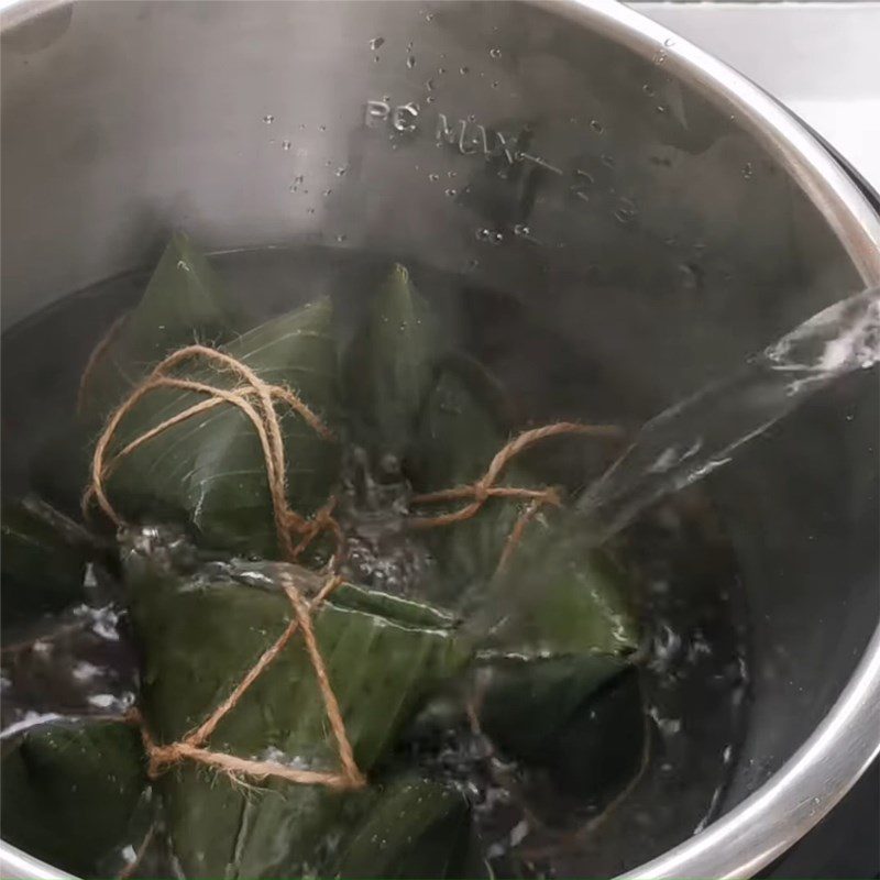 Step 7 Boil the cake Gấc sticky rice cake with mung bean filling