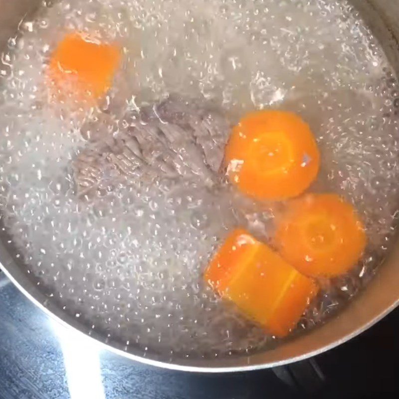 Step 2 Boil beef with carrots Beef porridge with water spinach for baby weaning