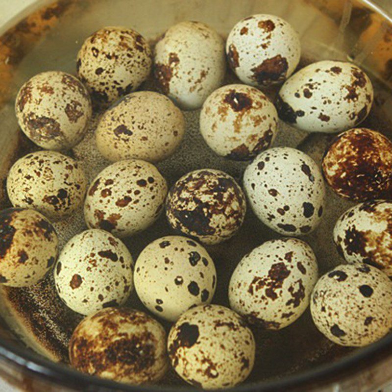 Step 1 Boil and peel quail eggs Fish Cake wrapped in Quail Eggs with Tomato Sauce