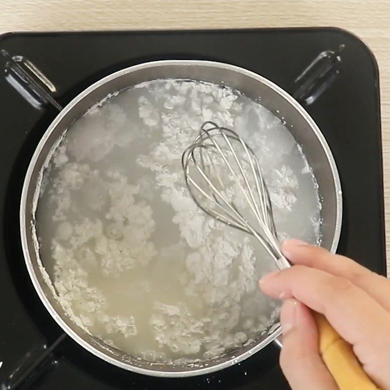 Step 2 Cook the rice flour mixture Grilled Coconut Milk Cake with a pan