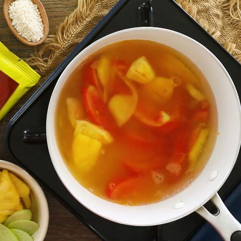 Step 4 Cook bitter melon and dọc mùng soup Sour bitter melon soup with vegetarian dọc mùng