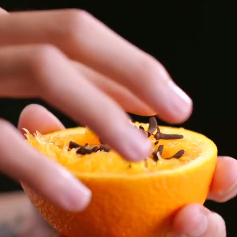 Step 1 Cook the mixture of cinnamon, orange, and clove syrup for hot gluhwein