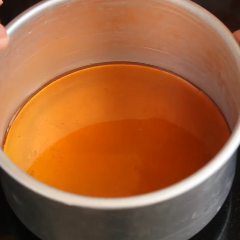 Step 1 Cook sugar to make caramel for egg-free mango flan