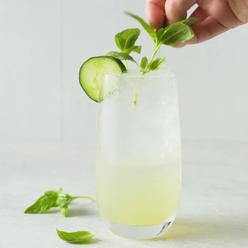 Step 2 Mix the cocktail and decorate Gin Tonic with cucumber and basil