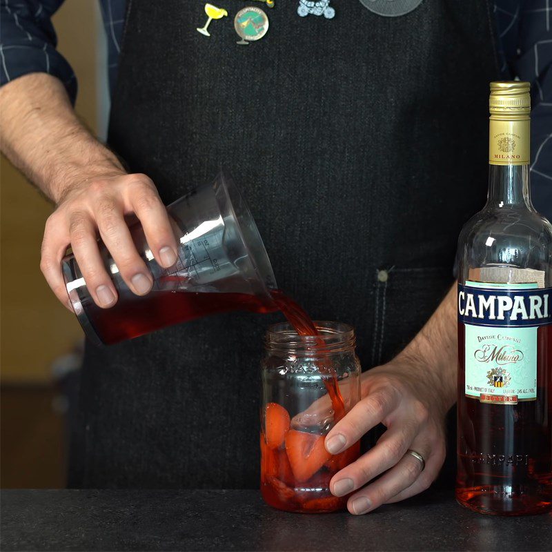 Step 1 Prepare Strawberries and Soak in Campari Strawberry Negroni Cocktail