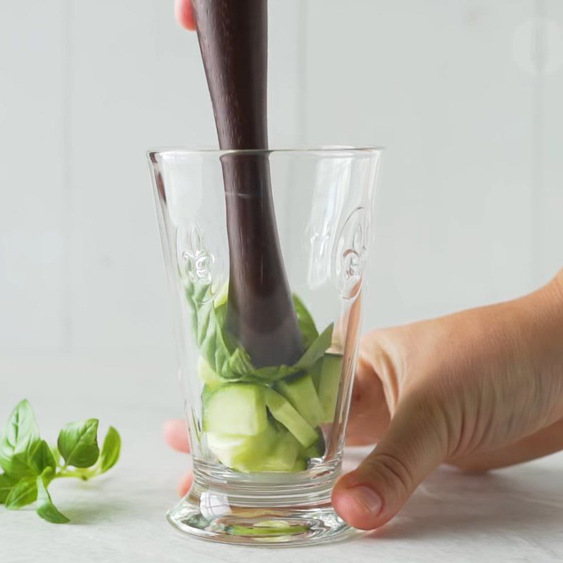 Step 1 Prepare and muddle the ingredients for Basil Cucumber Gin Tonic