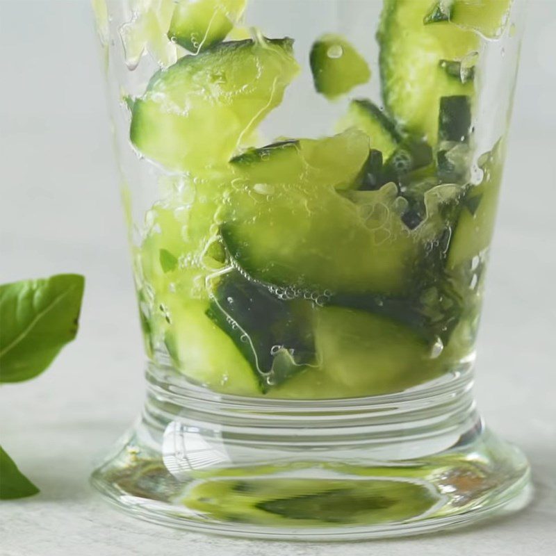 Step 1 Prepare and muddle ingredients for Gin Tonic with cucumber and basil