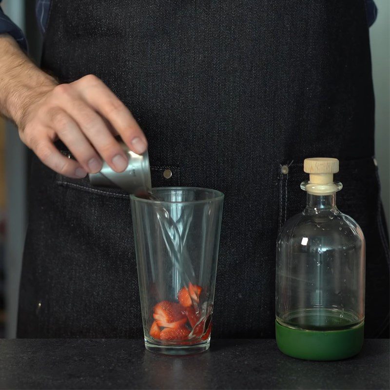 Step 1 Prepare and mash the strawberries for Strawberry Lemonade Cocktail