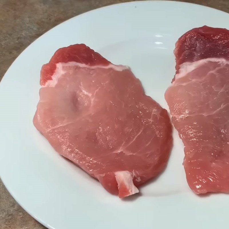 Step 1 Preparation and Marinating Meat for Spicy Sour Soup