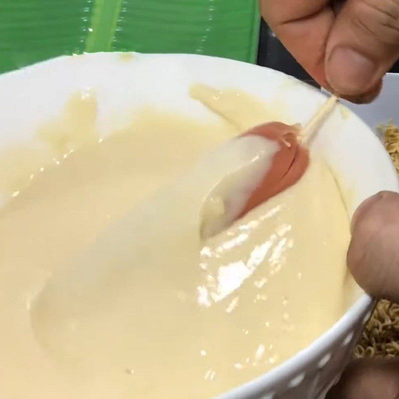 Step 3 Breading and coating the sausage with instant noodles Fried sausage with instant noodles