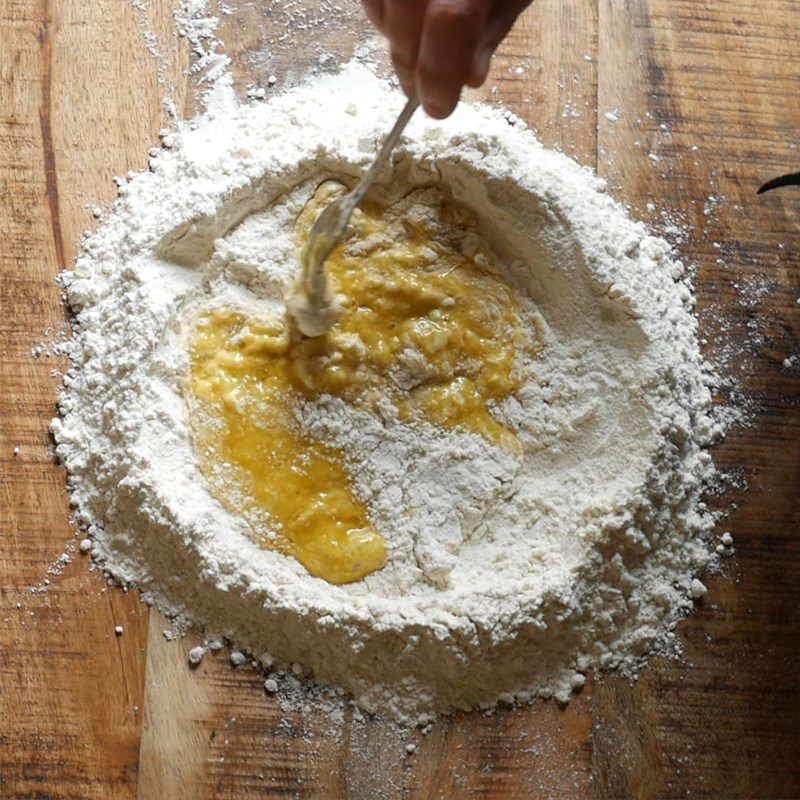 Step 1 Mixing the dough for cheese-filled ravioli with melted eggs