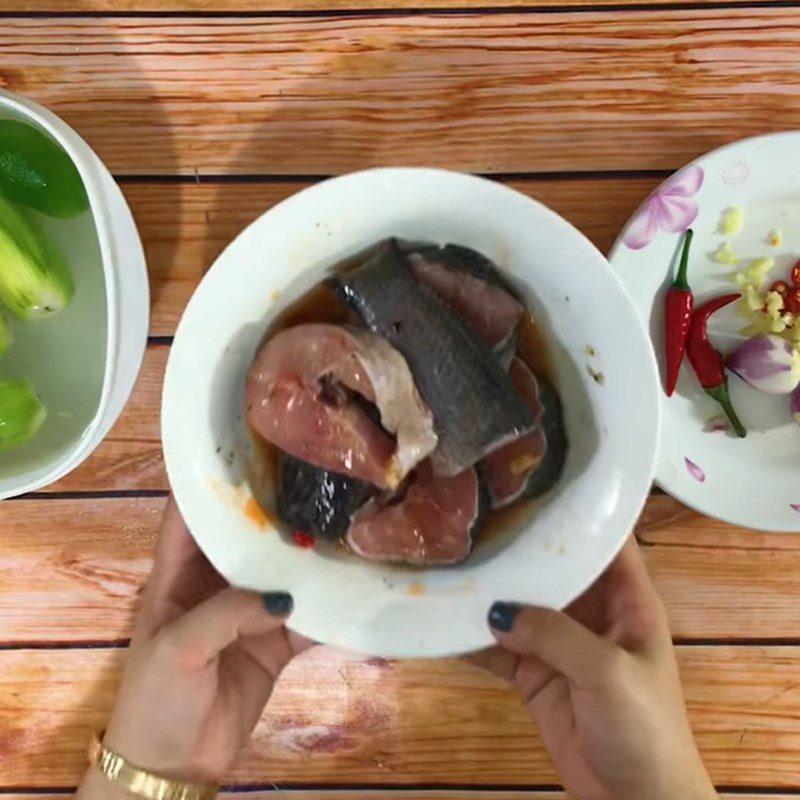 Step 2 Marinate fish Snakehead fish stewed with green bananas