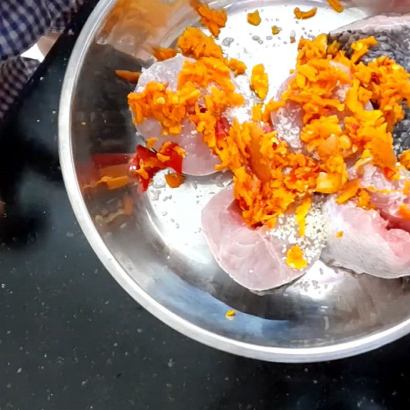 Step 2 Marinate fish Snakehead fish cooked with green bananas and turmeric