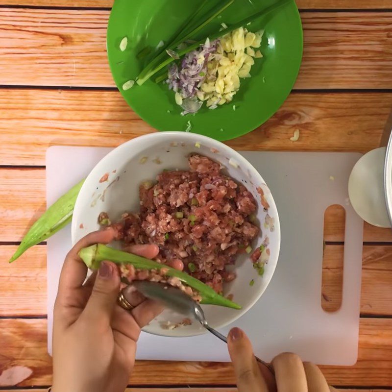 Step 2 Marinate the meat and stuff the okra Steamed meat okra