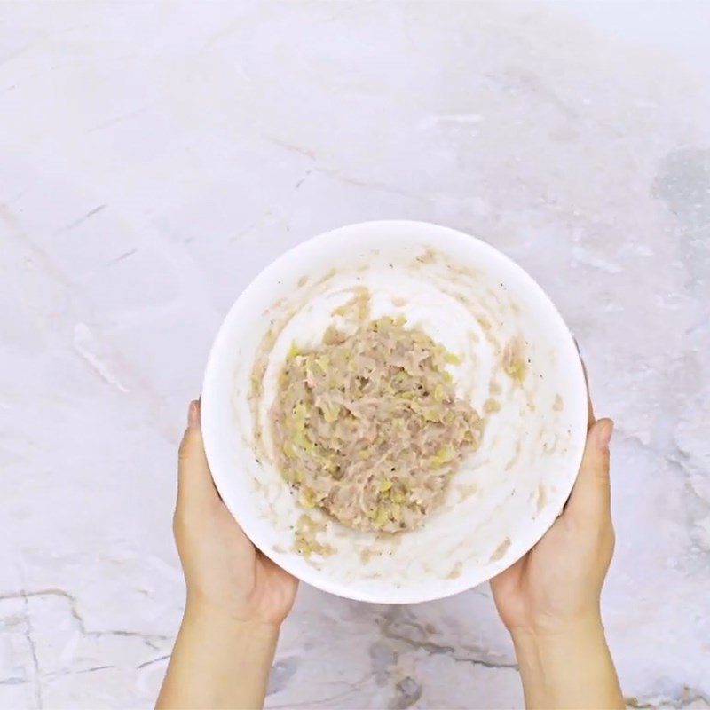 Step 2 Shape the fish paste with rice flakes Fried snakehead fish with green rice