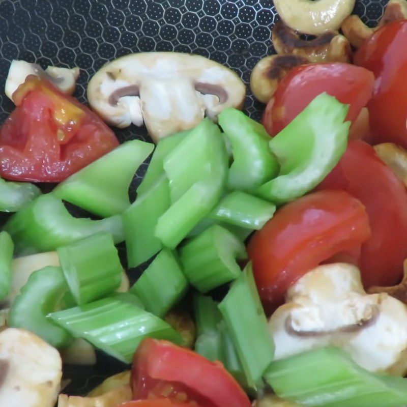 Step 2 Stir-fry tomatoes, cashews, and celery for Cashew Potato Soup