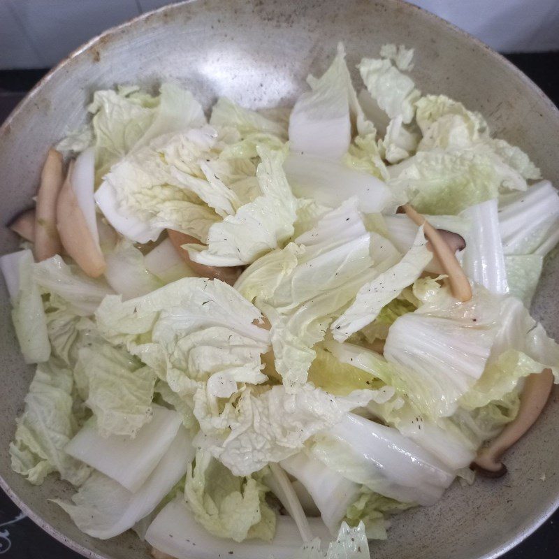 Step 2 Stir-fry the mixture for Stir-fried Napa cabbage with king oyster mushrooms